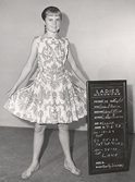 Heather shows off her Do Re Mi dress in continuity photo