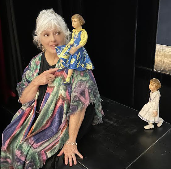 Angela meets her Brigitta Marionette at the Salzburg Marionette Theater where they perform The Sound of Music