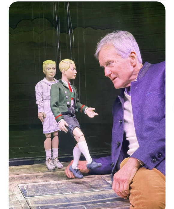 Nicholas meets his Frederich Marionette at the Salzburg Marionette Theater where they perform The Sound of Music
